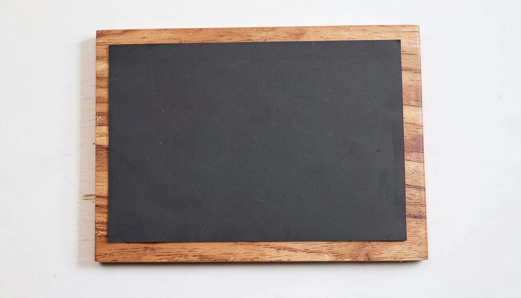 Warm wood-grain textured border framing a small dark charcoal panel, cozy scrapbook-style edge